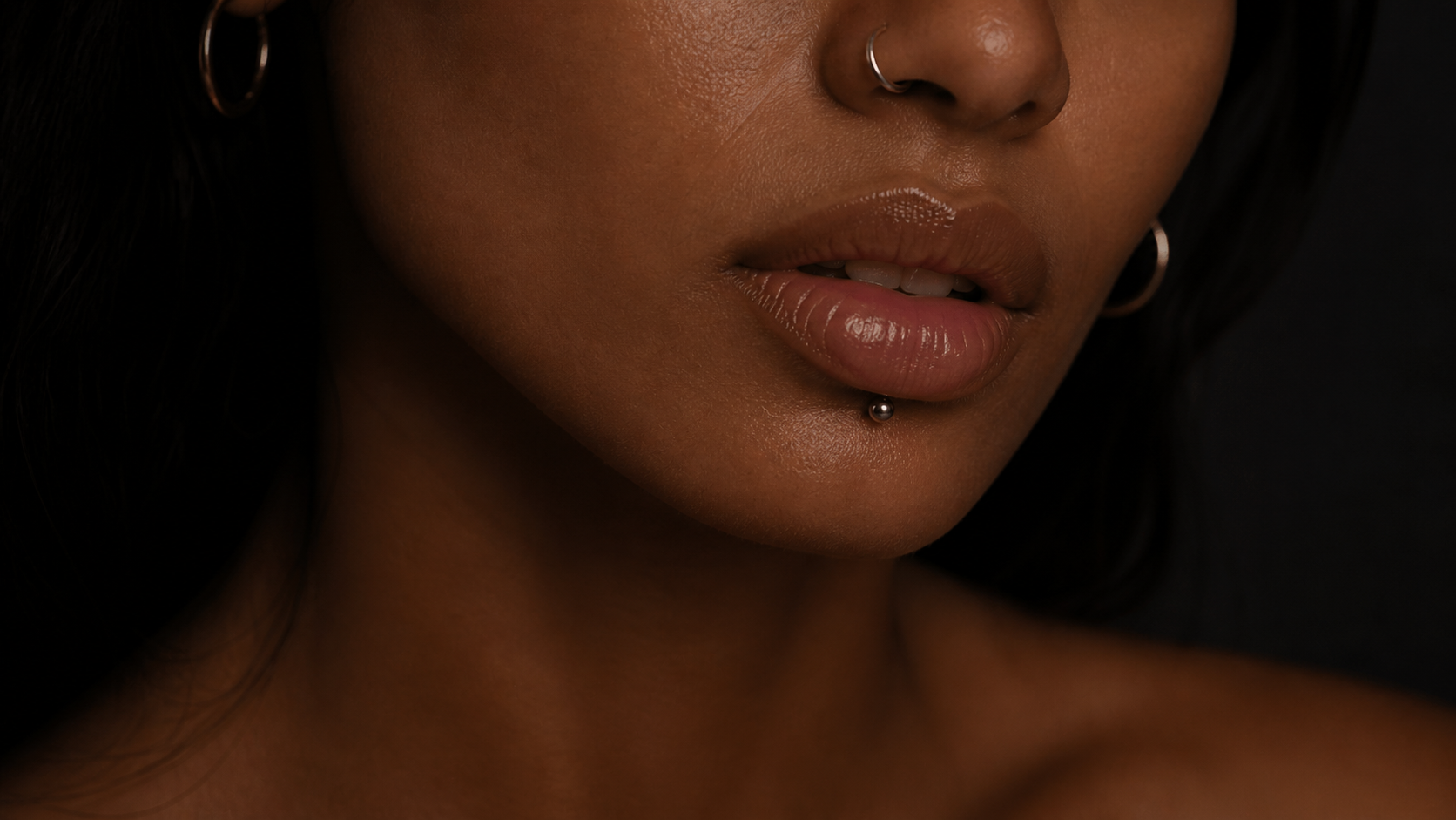 Facial and oral piercings: nostril ring and lip piercing